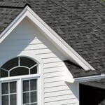 High-quality asphalt shingle roof on a modern residential home.