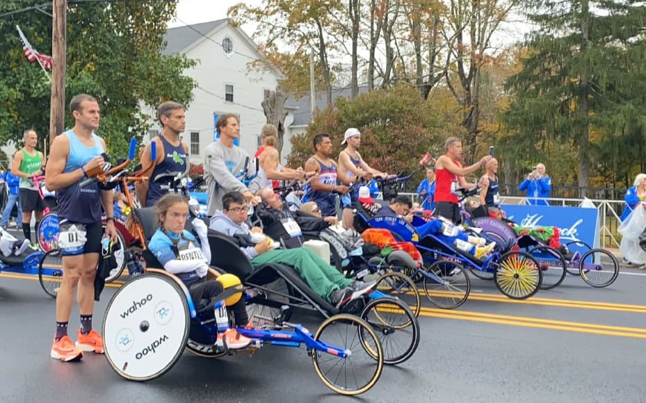 Accessible sports event featuring competitive handcycles and adaptive racing chairs.