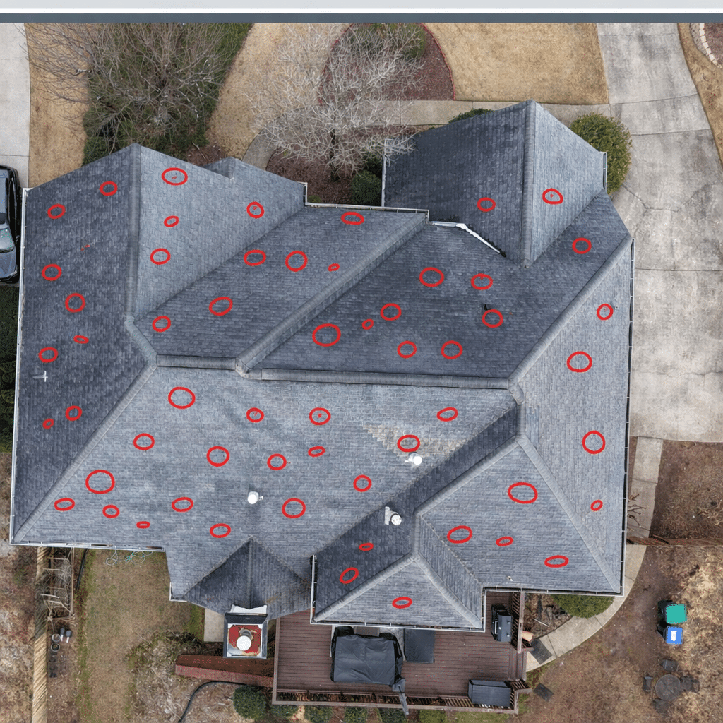AI-annotated roof image highlighting grouped potential hail-impact indicators for structured documentation review by Inspector Roofing and Restoration