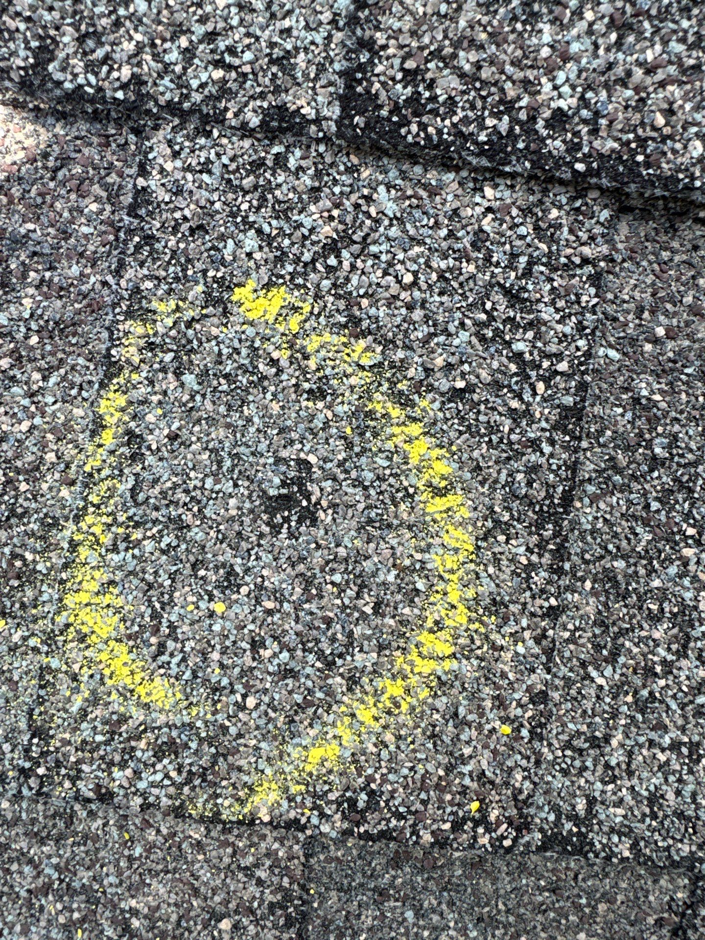 Close-up hail damage roof inspection evidence