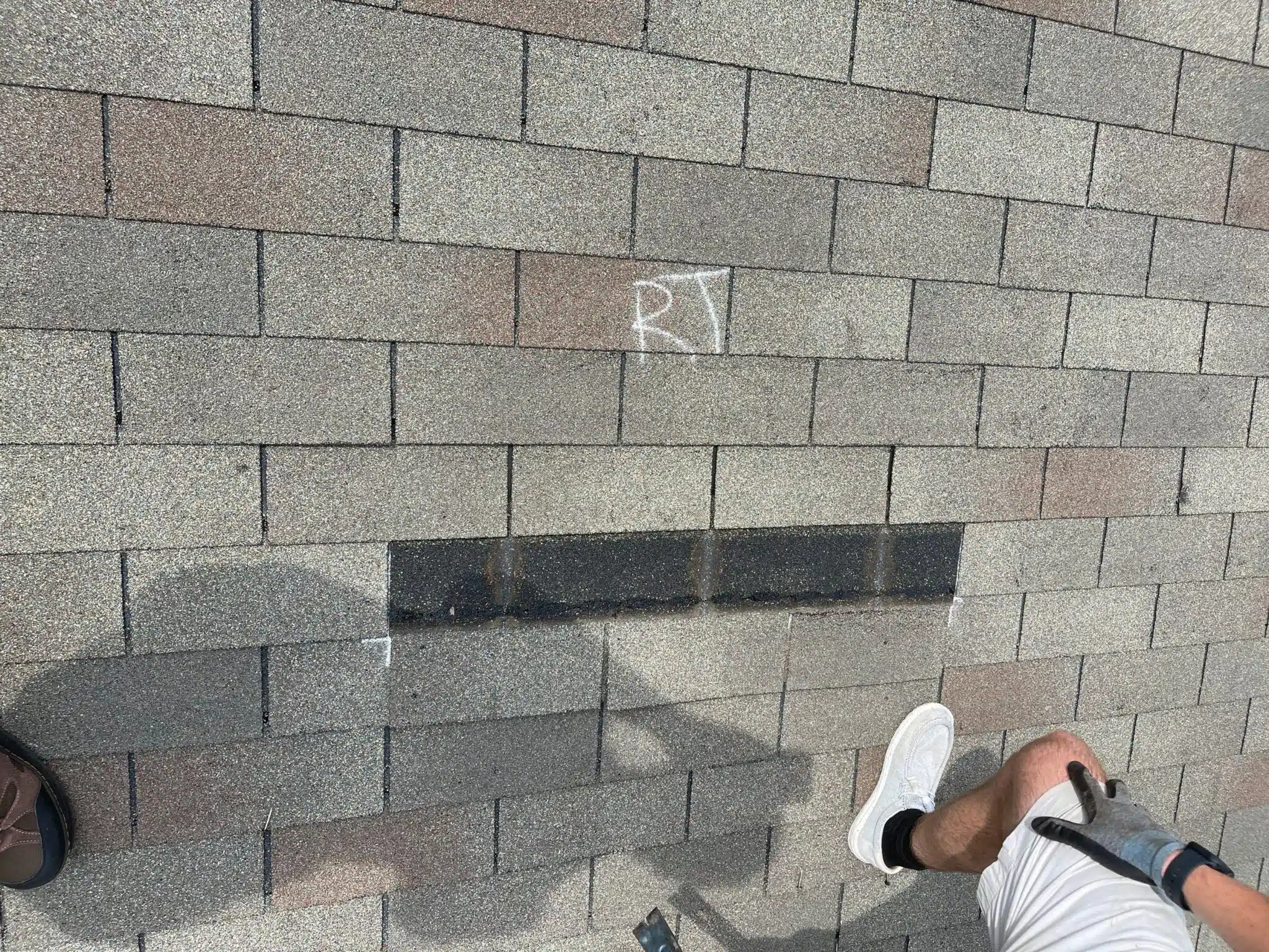 Missing shingles documented during an insurance roof inspection in Alpharetta, GA