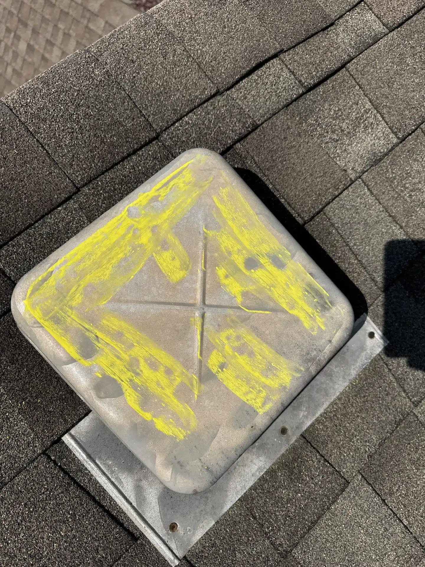Hail damage documented on soft metal roof vent during a roof inspection in Cumming, GA