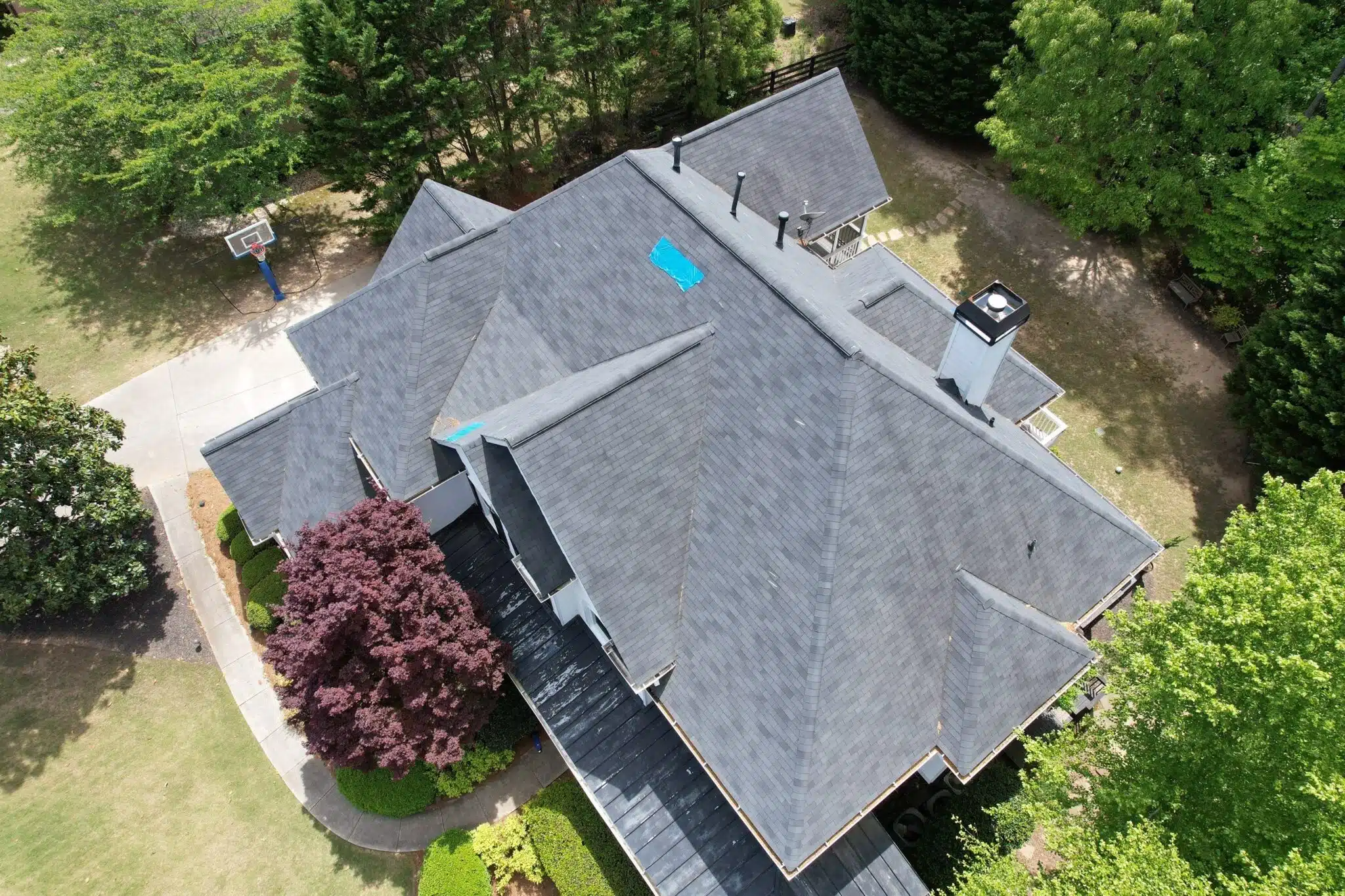Emergency roof tarp installed during a storm damage inspection in Milton, GA