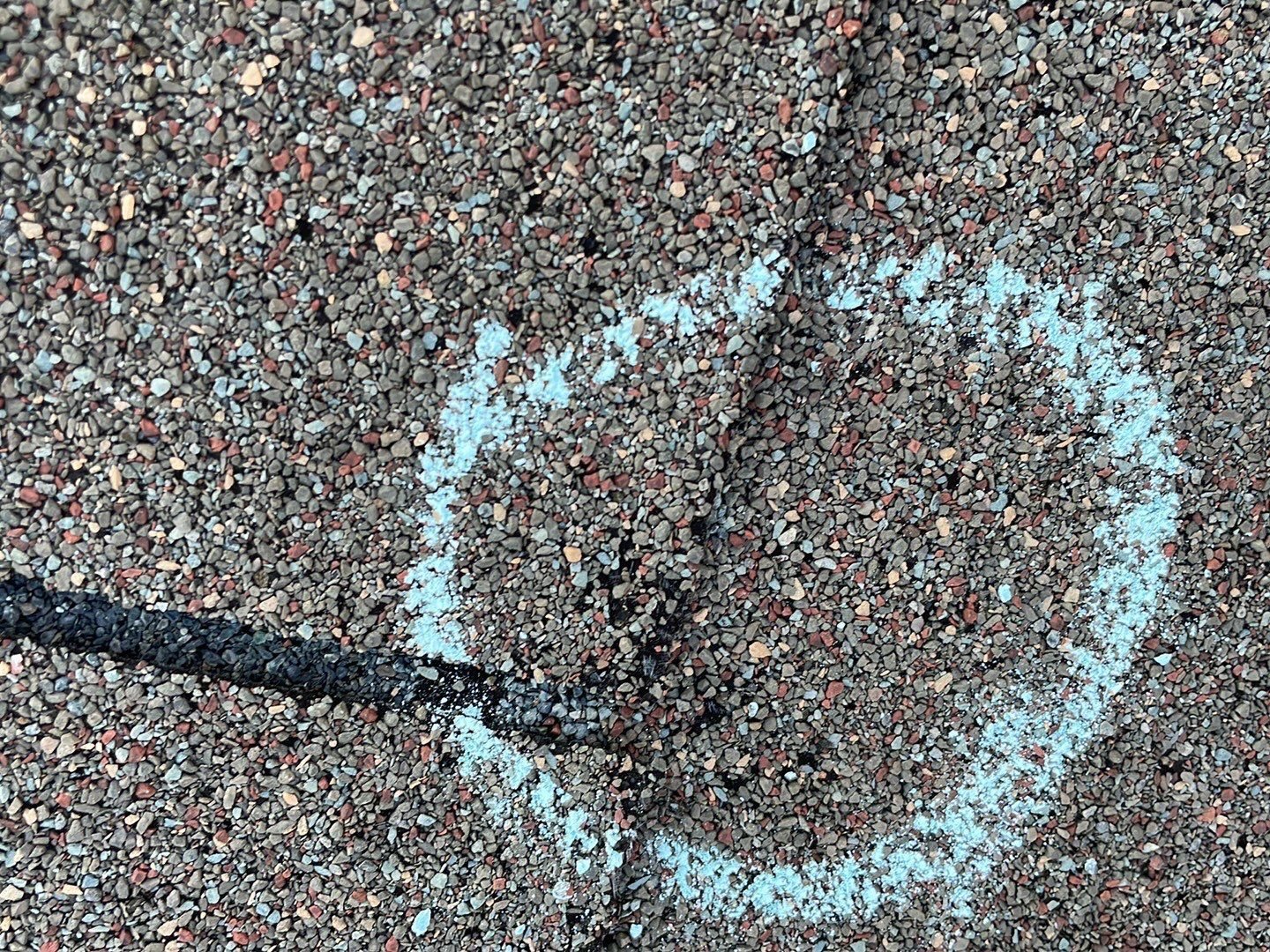 Hail impact documented with chalk on a Cumming roof