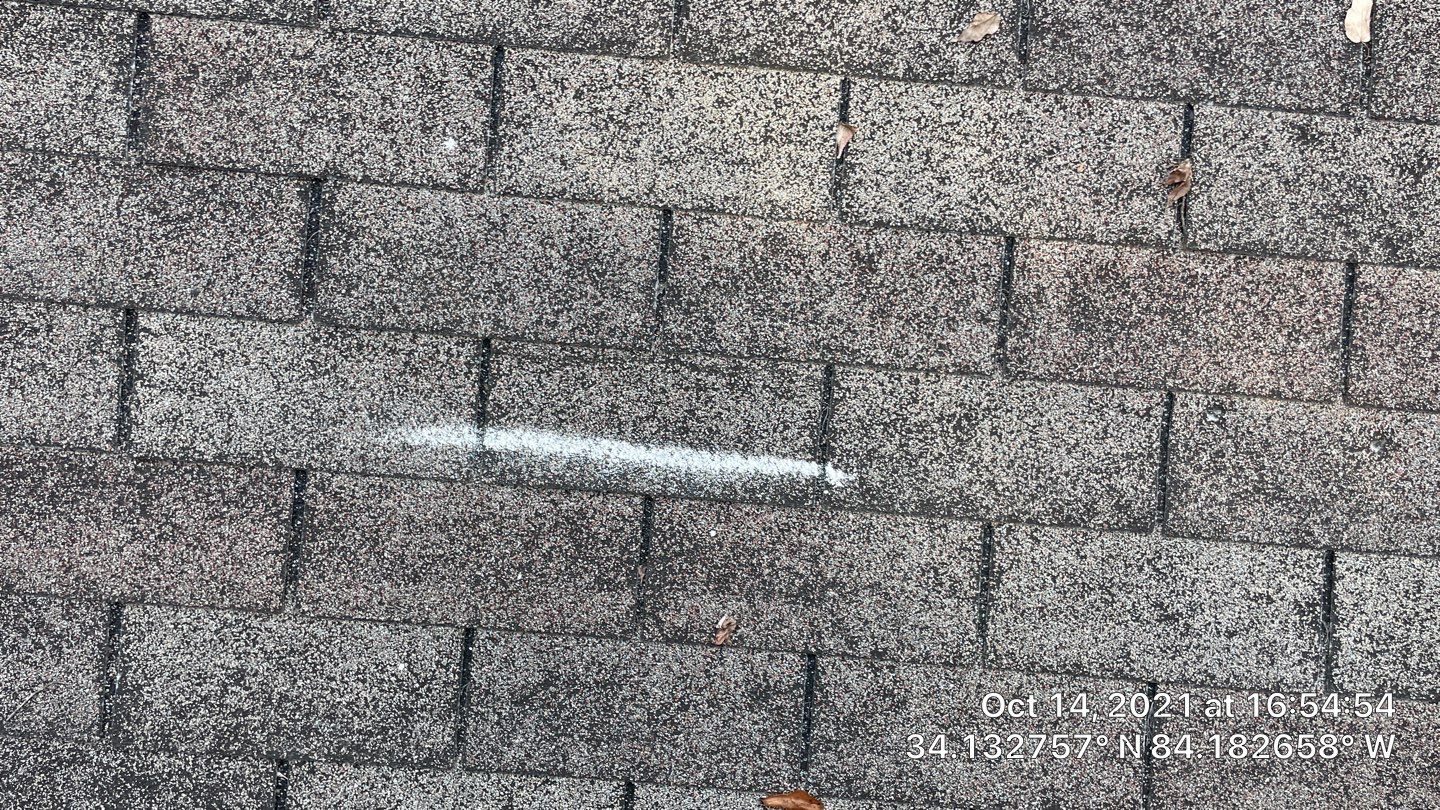Cumming roof hail documentation photo