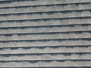 Shingle roof field showing weathering and granule wear patterns